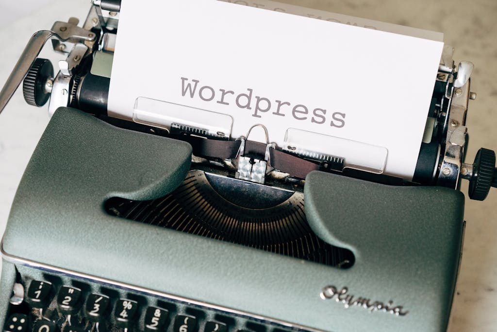 Close-up of a vintage typewriter with a paper displaying 'Wordpress' in retro style. Best Web Hosting for WordPress in 2026